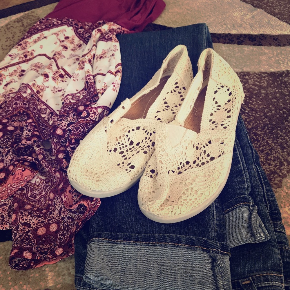 Cream crochet slip-on flats.